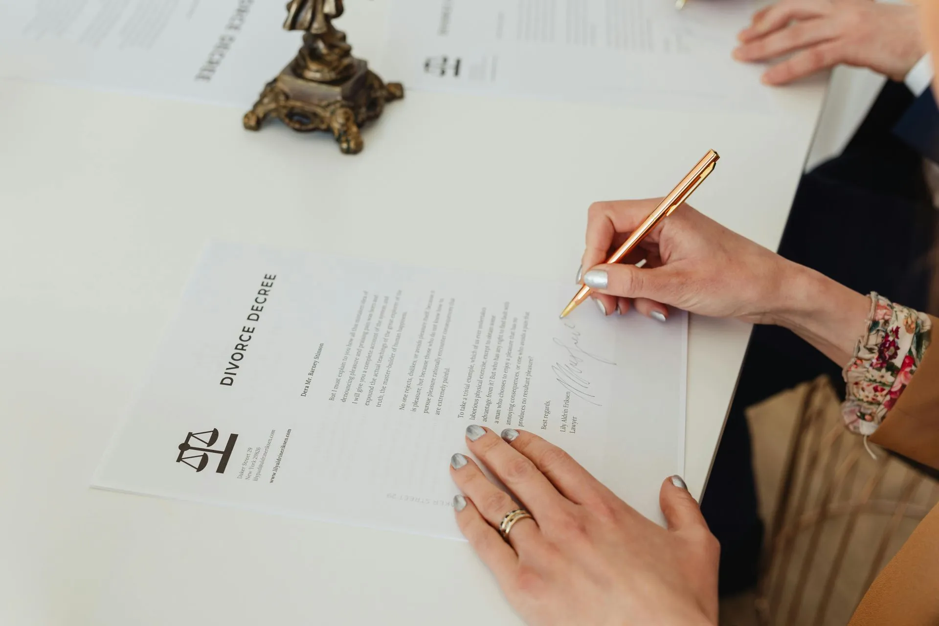 Hands writing on a document — Mediation process